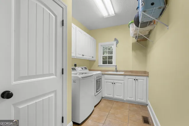 a bathroom with a sink toilet and mirror