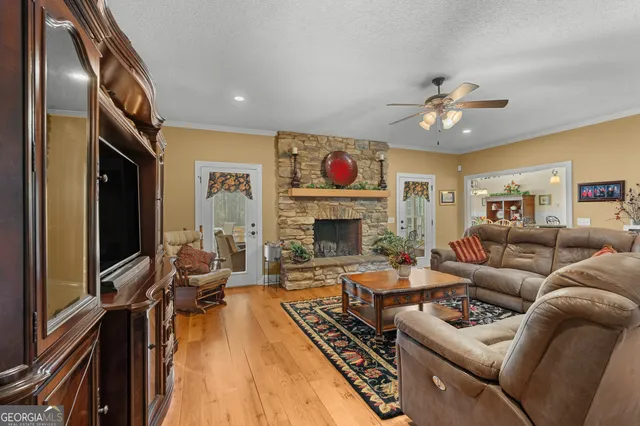 a kitchen with cabinets a center island stainless steel appliances and cabinets