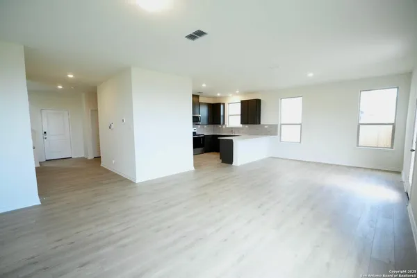 a view of living room with furniture and window