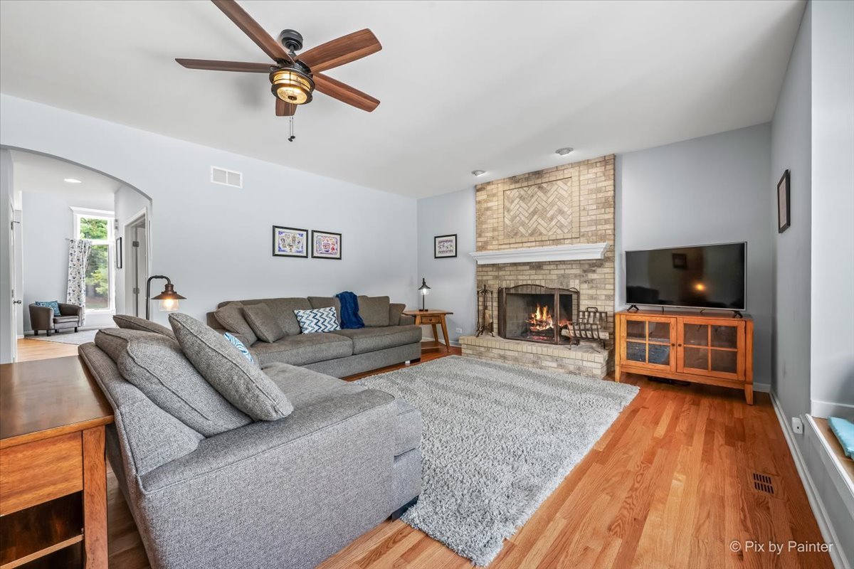 7104 Dove Way Cary, IL 60013 - Photo 13 of 82 a living room with furniture a flat screen tv and a fireplace