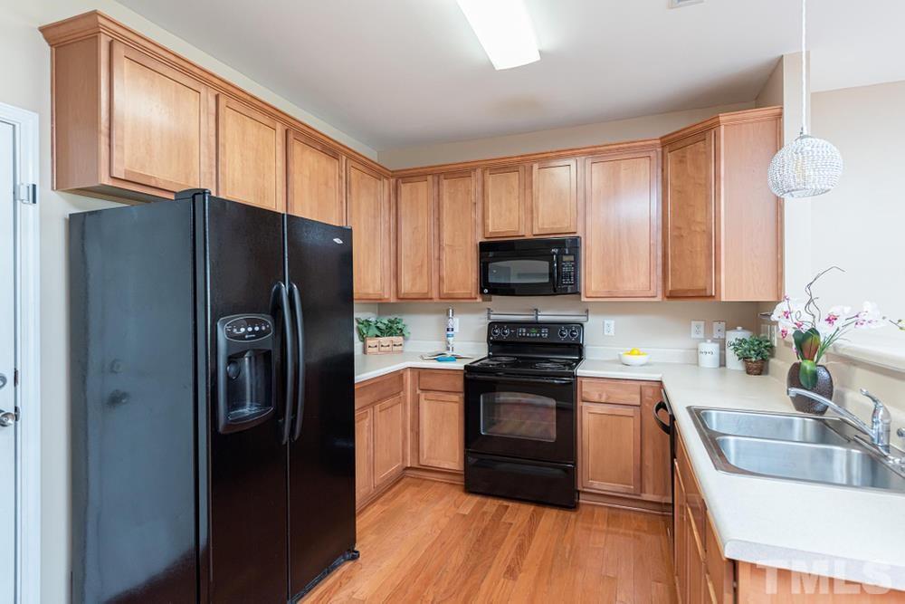 3519 Oneonta Avenue Raleigh, NC 27604 - Photo 11 of 30 Kitchean with L shaped counter for more space and tall maple cabinets.