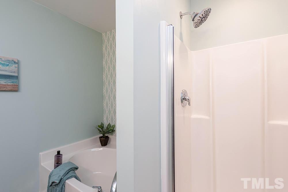 3519 Oneonta Avenue Raleigh, NC 27604 - Photo 18 of 30 Primary Bathroom features tub and separate walk-in shower.