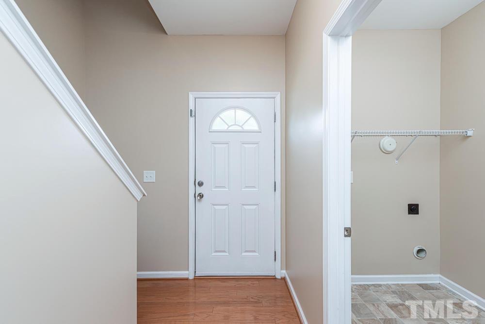 3519 Oneonta Avenue Raleigh, NC 27604 - Photo 3 of 30 Foyer opens up to hardwood floors and laundry room on the left.