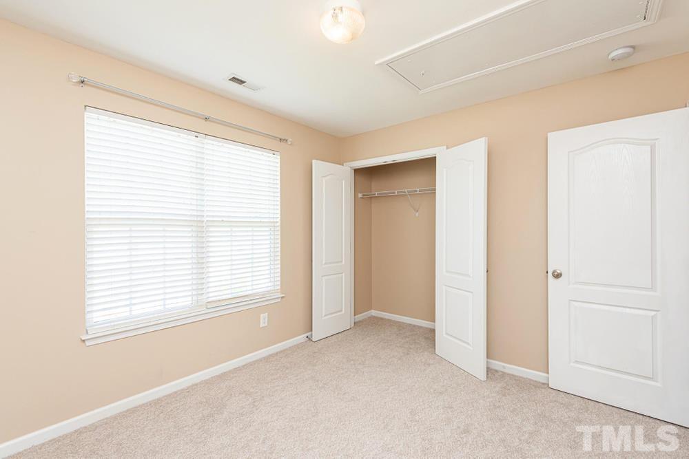 3519 Oneonta Avenue Raleigh, NC 27604 - Photo 21 of 30 Bedroom 2 closet and view of pull down attic location.