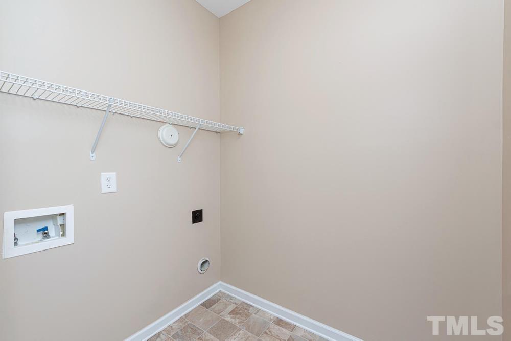 3519 Oneonta Avenue Raleigh, NC 27604 - Photo 4 of 30 Laundry room with wire shelving and electric dryer hookup.