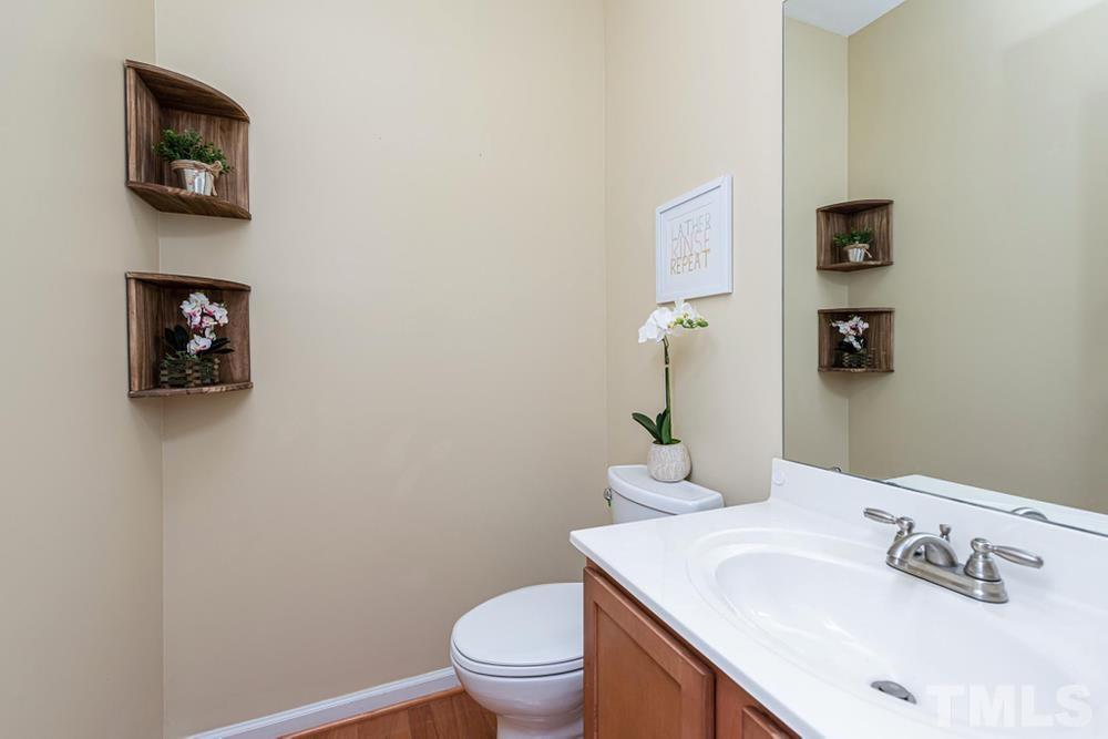 3519 Oneonta Avenue Raleigh, NC 27604 - Photo 5 of 30 Half bath with vanity with storage.
