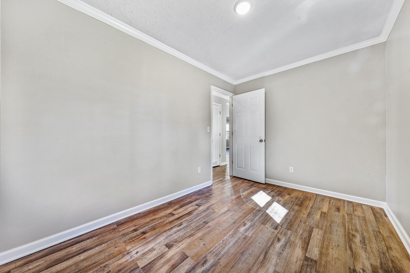 118 Rollins Road Sparta, TN 38583 - Photo 20 of 33 a view of an empty room with wooden floor