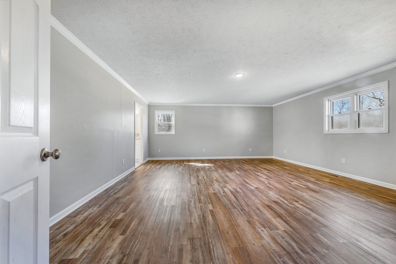 118 Rollins Road Sparta, TN 38583 - Photo 23 of 33 a view of empty room with wooden floor and fan
