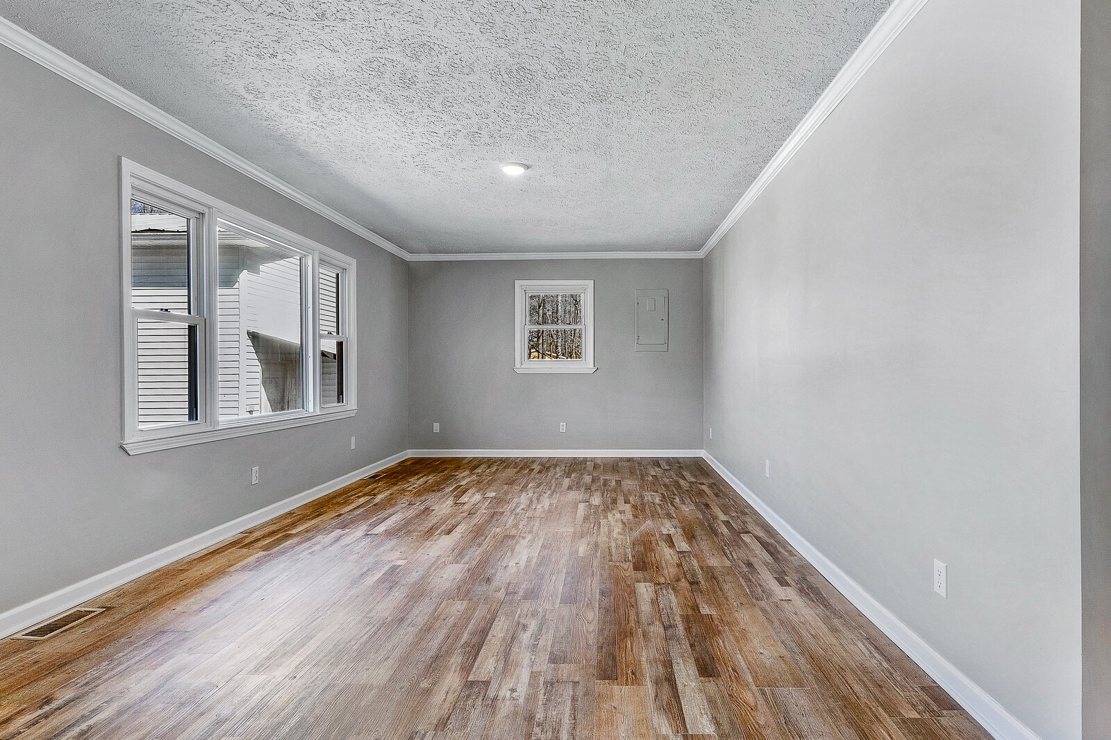 118 Rollins Road Sparta, TN 38583 - Photo 30 of 33 a view of an empty room with wooden floor and a window