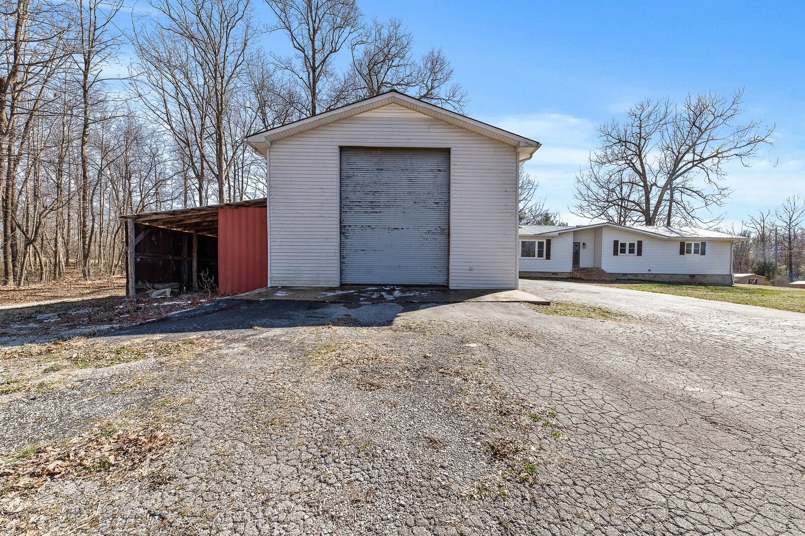 118 Rollins Road Sparta, TN 38583 - Photo 8 of 33 a front view of a house with a yard and garage