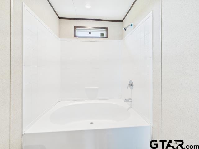 7191 Stella Street Murchison, TX 75778 - Photo 15 of 32 a bathroom with a bathtub