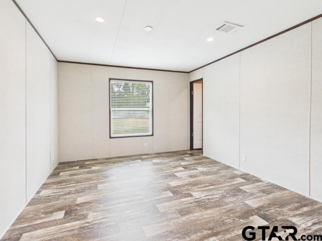 7191 Stella Street Murchison, TX 75778 - Photo 18 of 32 a view of an empty room with windows