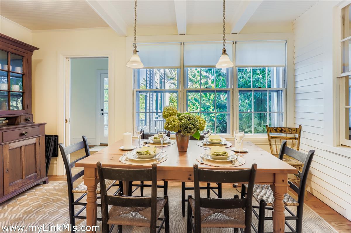 27 Spring Street Vineyard Haven, MA 02568 - Photo 9 of 58 a view of a dining room with furniture window and outside view