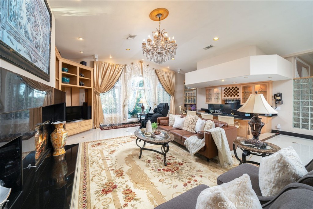 275 East 24th Street Upland, CA 91784 - Photo 12 of 74 a living room with furniture flowerpot and a chandelier