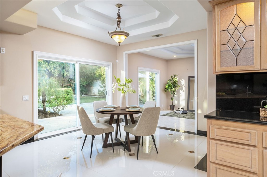 275 East 24th Street Upland, CA 91784 - Photo 19 of 74 a view of a dining room with furniture window and outside view