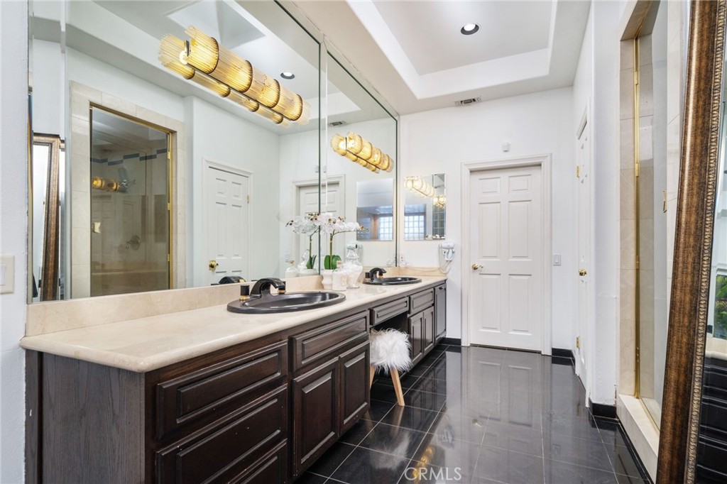 275 East 24th Street Upland, CA 91784 - Photo 24 of 74 a kitchen with a sink and cabinets