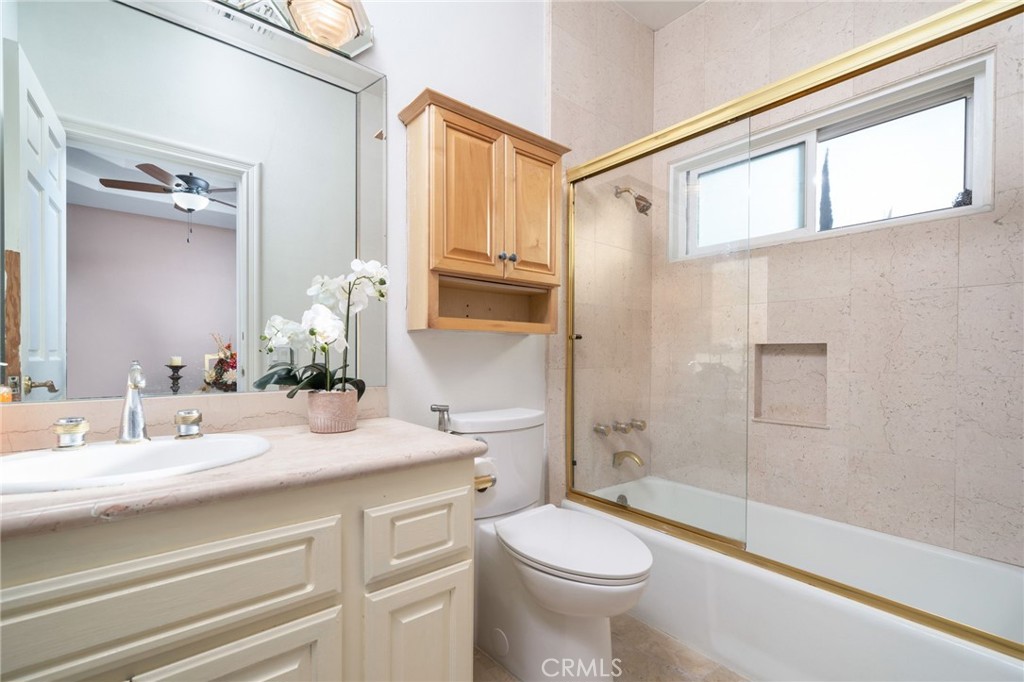 275 East 24th Street Upland, CA 91784 - Photo 27 of 74 a bathroom with a sink a toilet and shower