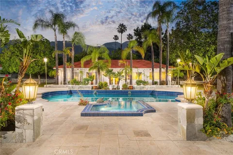a view of swimming pool with outdoor seating and yard