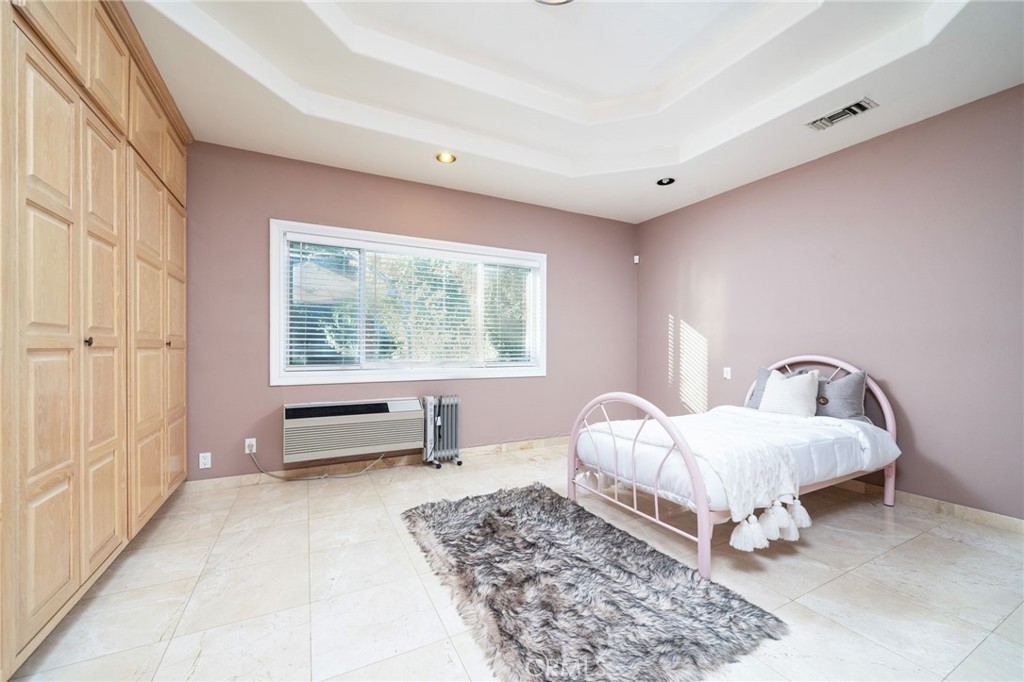 275 East 24th Street Upland, CA 91784 - Photo 33 of 74 a living room with furniture and a window