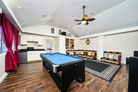 a house with swimming pool in front of it