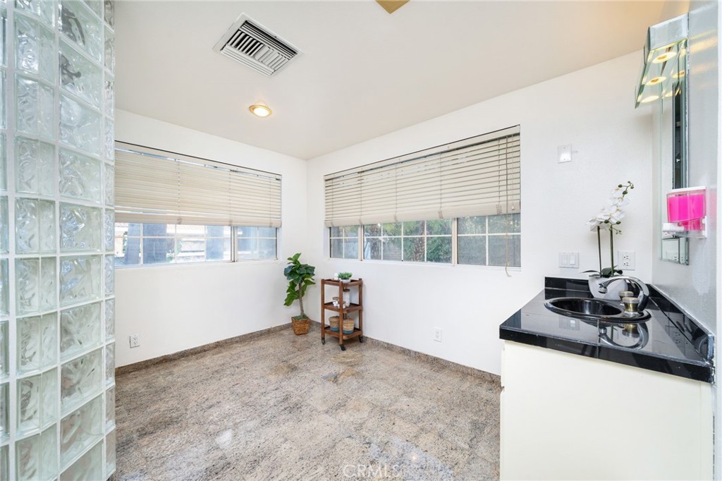 275 East 24th Street Upland, CA 91784 - Photo 41 of 74 a room with furniture and a large window