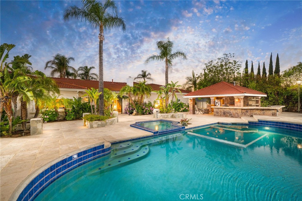 275 East 24th Street Upland, CA 91784 - Photo 50 of 74 a swimming pool with outdoor seating and yard