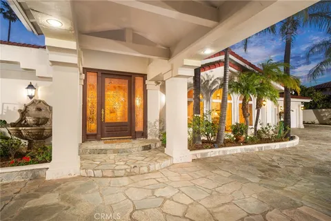 a view of a porch with wooden floor and windows