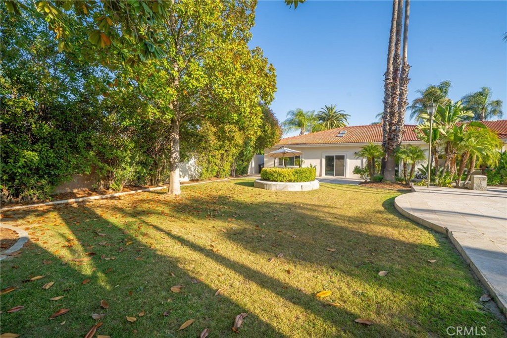 275 East 24th Street Upland, CA 91784 - Photo 53 of 74 a view of house with outdoor space and swimming pool