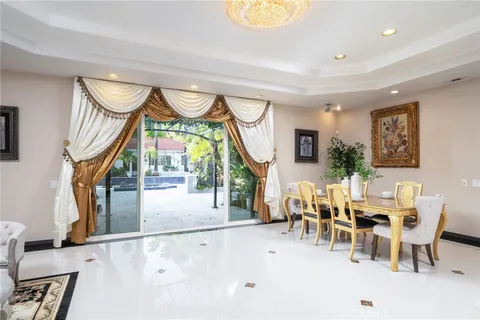 an outdoor space with garden view and wooden floor