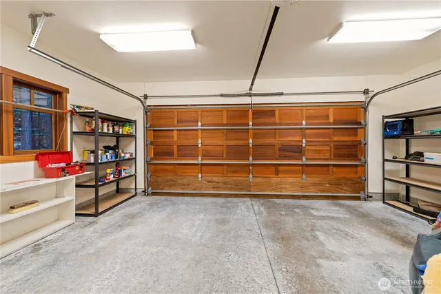 a view of an empty room with storage and utility