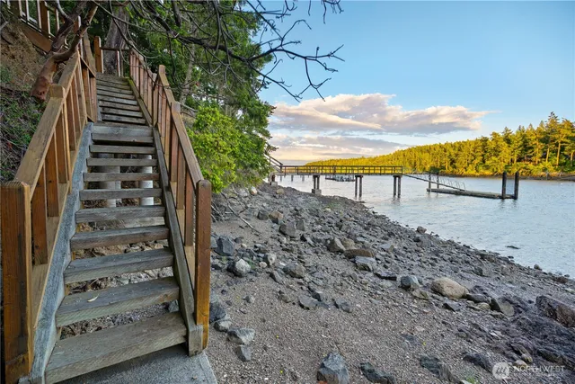 a view of a backyard with wooden fence