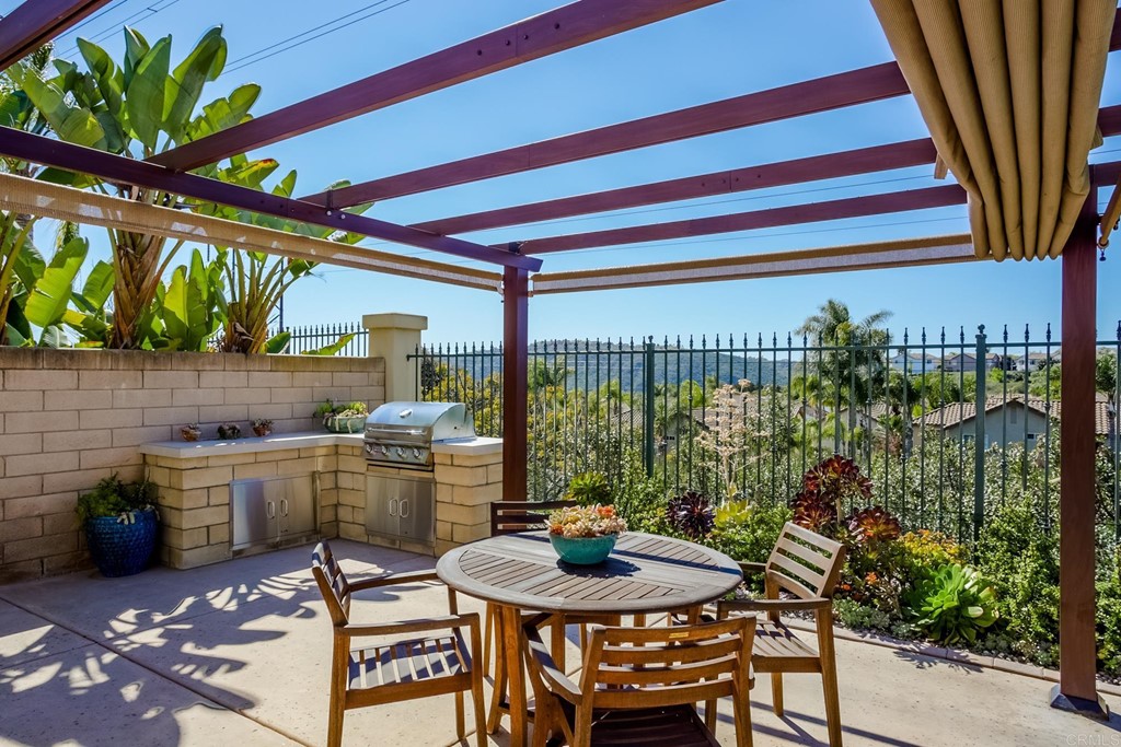 1732 Blackbird Circle Carlsbad, CA 92011 - Photo 15 of 39 a outdoor dining space with furniture and outdoor kitchen