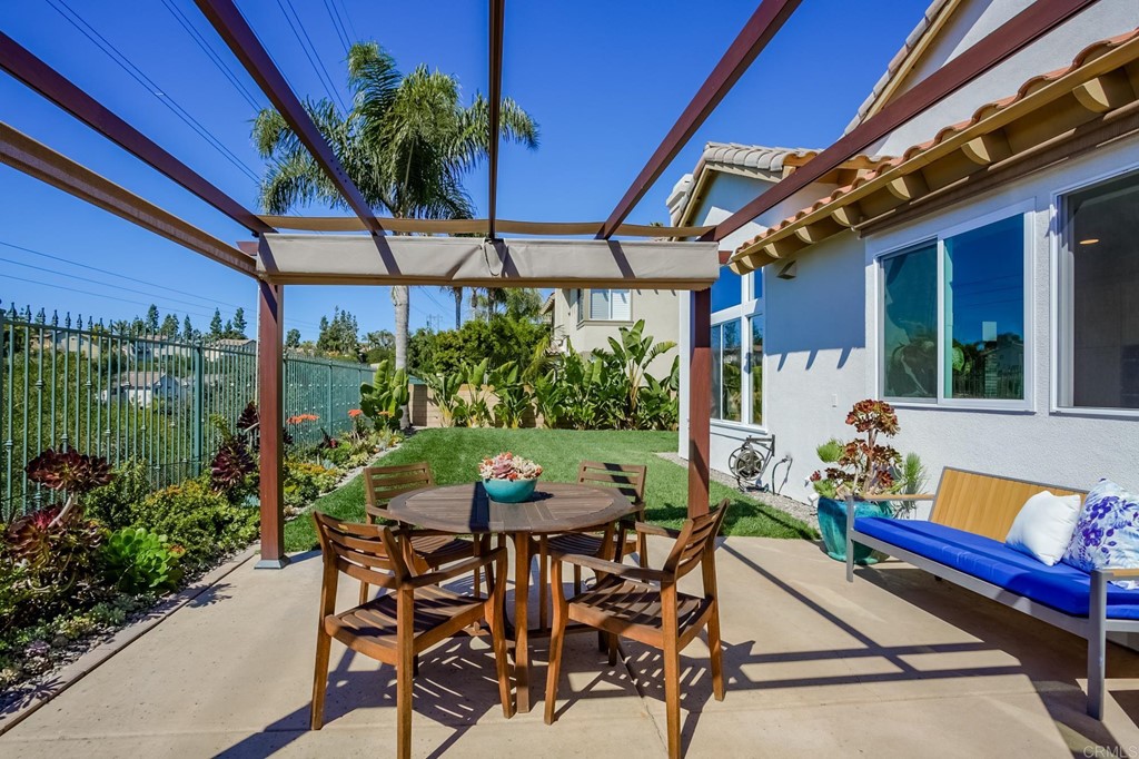 1732 Blackbird Circle Carlsbad, CA 92011 - Photo 19 of 39 a view of a chairs and table in patio with a barbeque