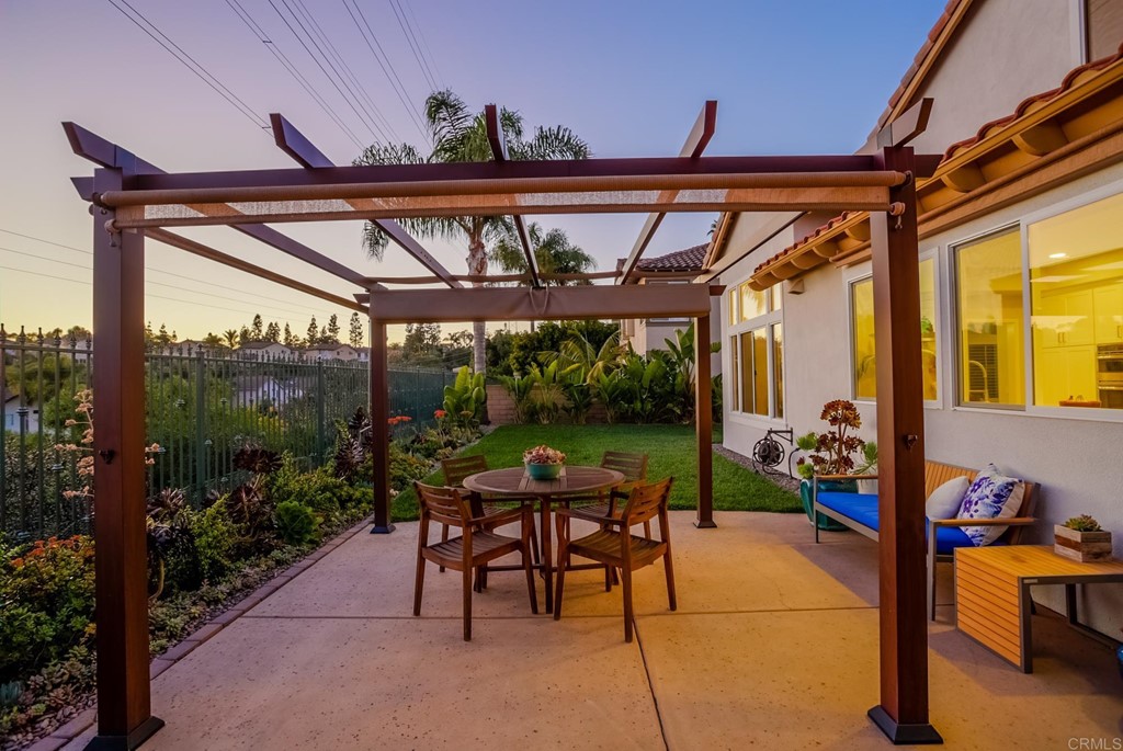 1732 Blackbird Circle Carlsbad, CA 92011 - Photo 20 of 39 a patio with yard glass top table and chairs