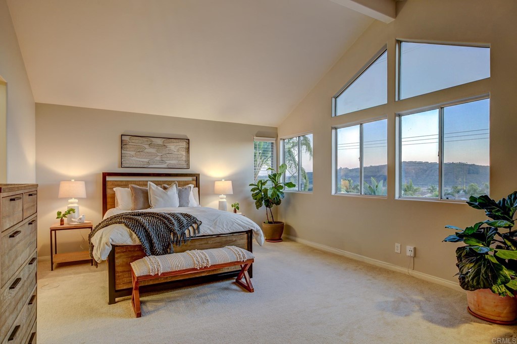 1732 Blackbird Circle Carlsbad, CA 92011 - Photo 26 of 39 a spacious bedroom with a bed and a couch