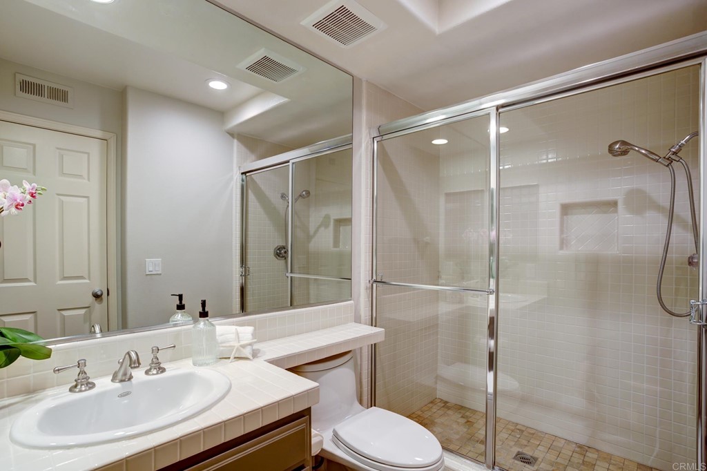 1732 Blackbird Circle Carlsbad, CA 92011 - Photo 34 of 39 a bathroom with a sink toilet and shower