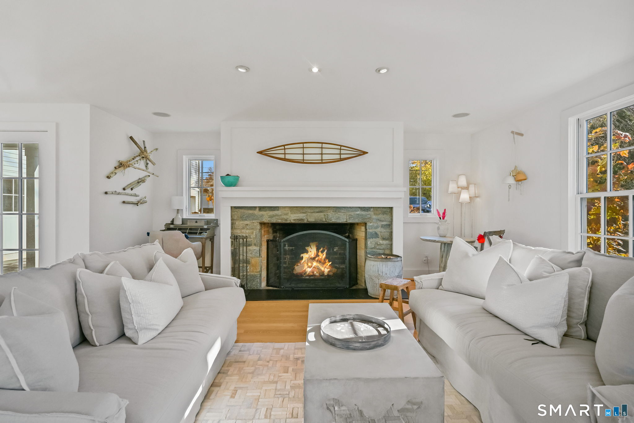 150 Hillspoint Road Westport, CT 06880 - Photo 13 of 40 a living room with furniture and a fireplace