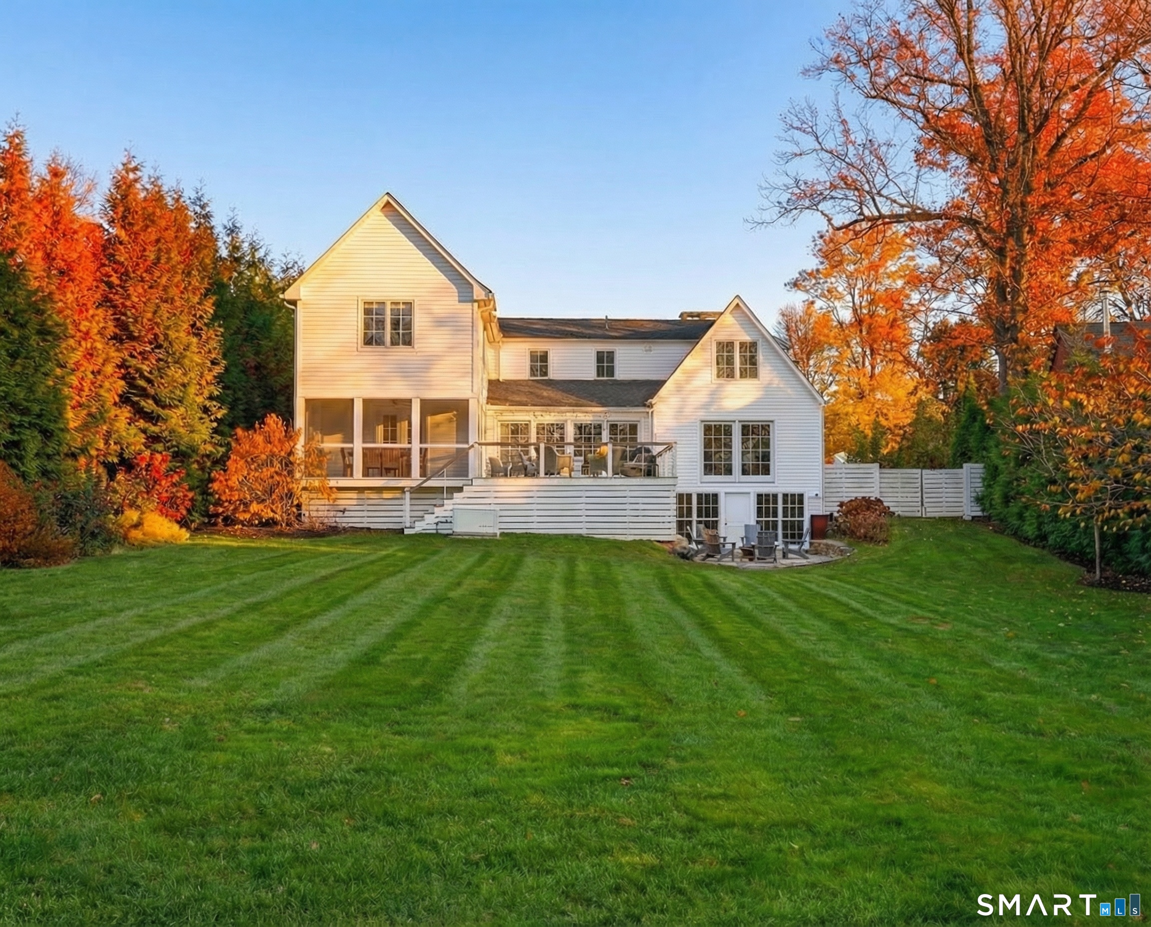 150 Hillspoint Road Westport, CT 06880 - Photo 15 of 40 a view of a house with a backyard