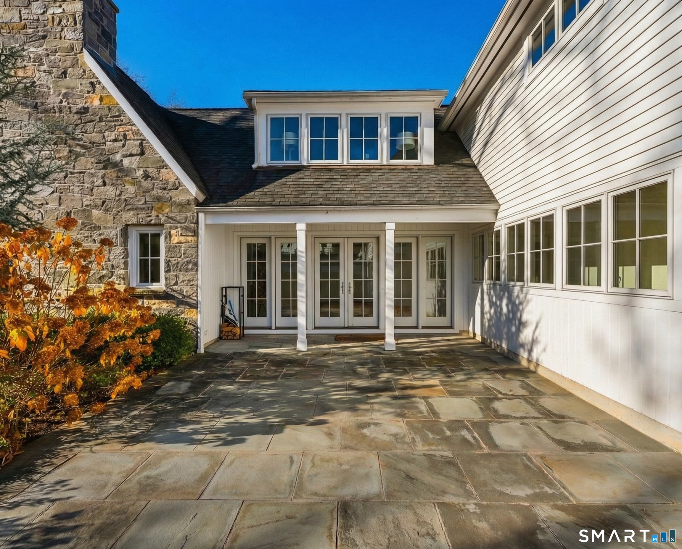 150 Hillspoint Road Westport, CT 06880 - Photo 16 of 40 a front view of a house with a garden
