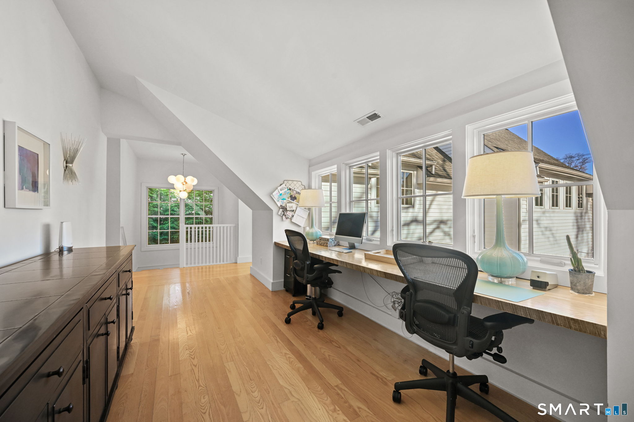 150 Hillspoint Road Westport, CT 06880 - Photo 17 of 40 a view of a workspace with furniture and a window