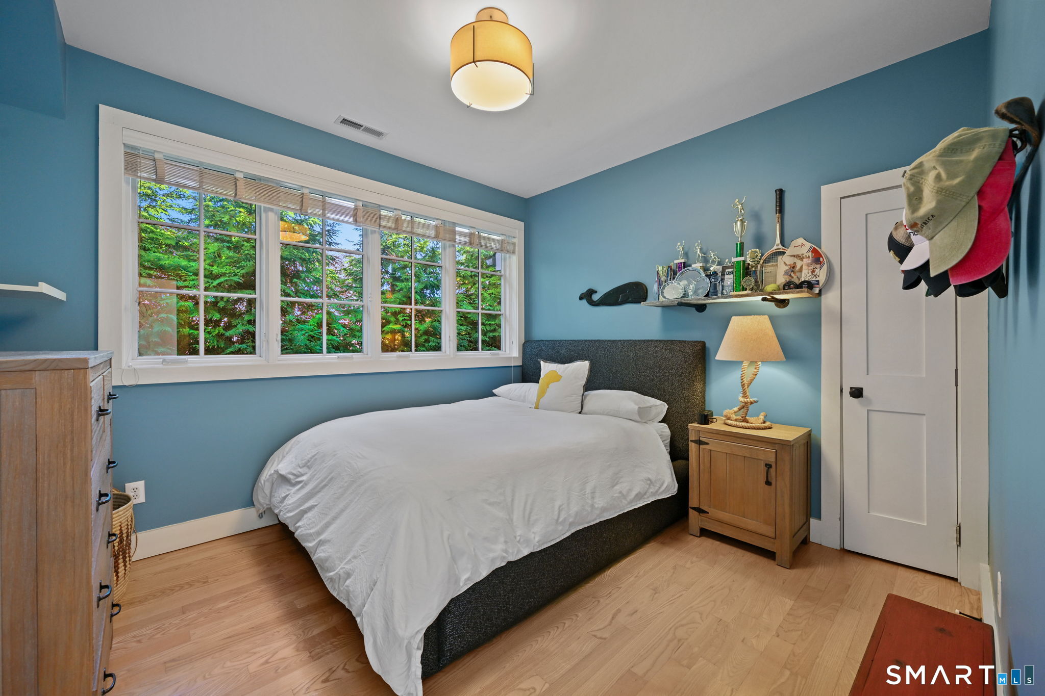 150 Hillspoint Road Westport, CT 06880 - Photo 27 of 40 a bedroom with a bed and a window