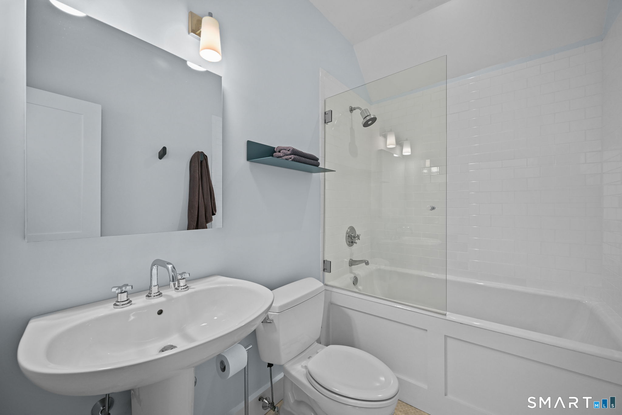 150 Hillspoint Road Westport, CT 06880 - Photo 28 of 40 a bathroom with a sink a toilet and shower