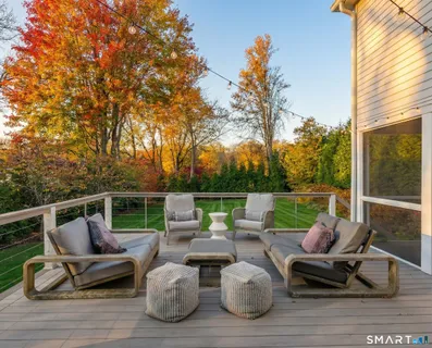 a view of a patio with a table and chairs and a fire pit