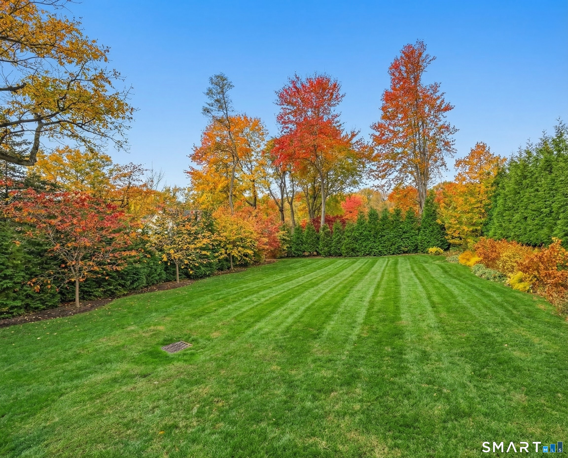 150 Hillspoint Road Westport, CT 06880 - Photo 35 of 40 a aerial view of a house with a yard