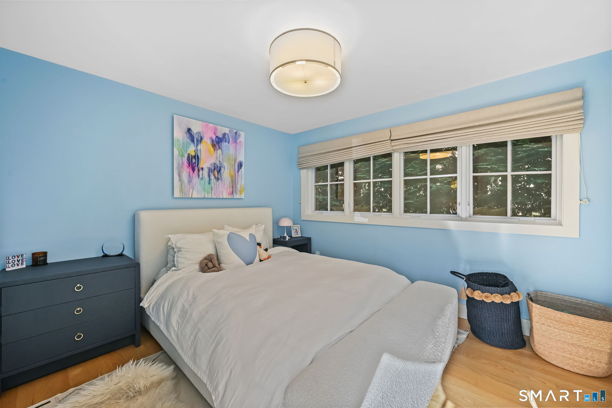 150 Hillspoint Road Westport, CT 06880 - Photo 8 of 40 a bedroom with a bed and a window