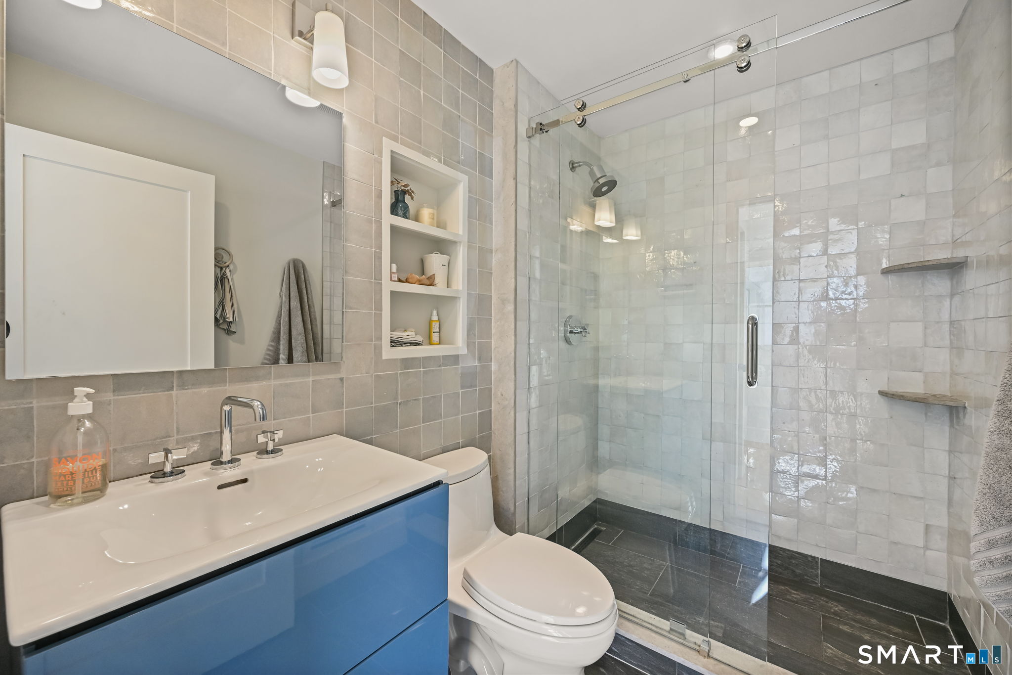 150 Hillspoint Road Westport, CT 06880 - Photo 9 of 40 a bathroom with a sink a toilet and shower