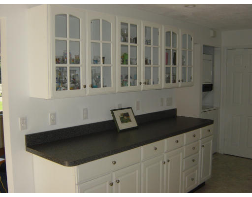 25-27 Pondover Road Billerica, MA 01821 - Photo 8 of 8 a kitchen with a sink and cabinets