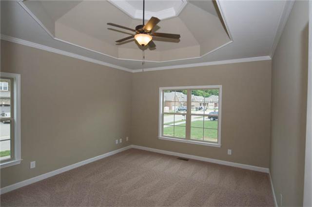 2007 Rudder Court Spring Hill, TN 37174 - Photo 6 of 18 Treyed ceiling in the master bedroom also located on the main floor. Stock photo in a different color pallet.