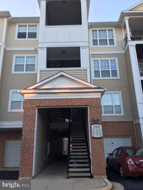13501 Kildare Hills Terrace, Unit 402 Germantown, MD 20874 - Photo 1 of 14 a front view of a house with a balcony