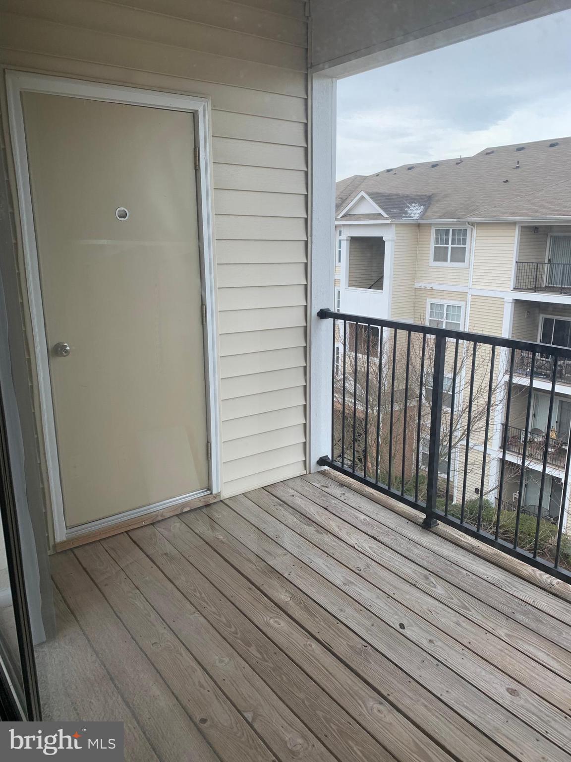 13501 Kildare Hills Terrace, Unit 402 Germantown, MD 20874 - Photo 14 of 14 a view of backyard with a deck